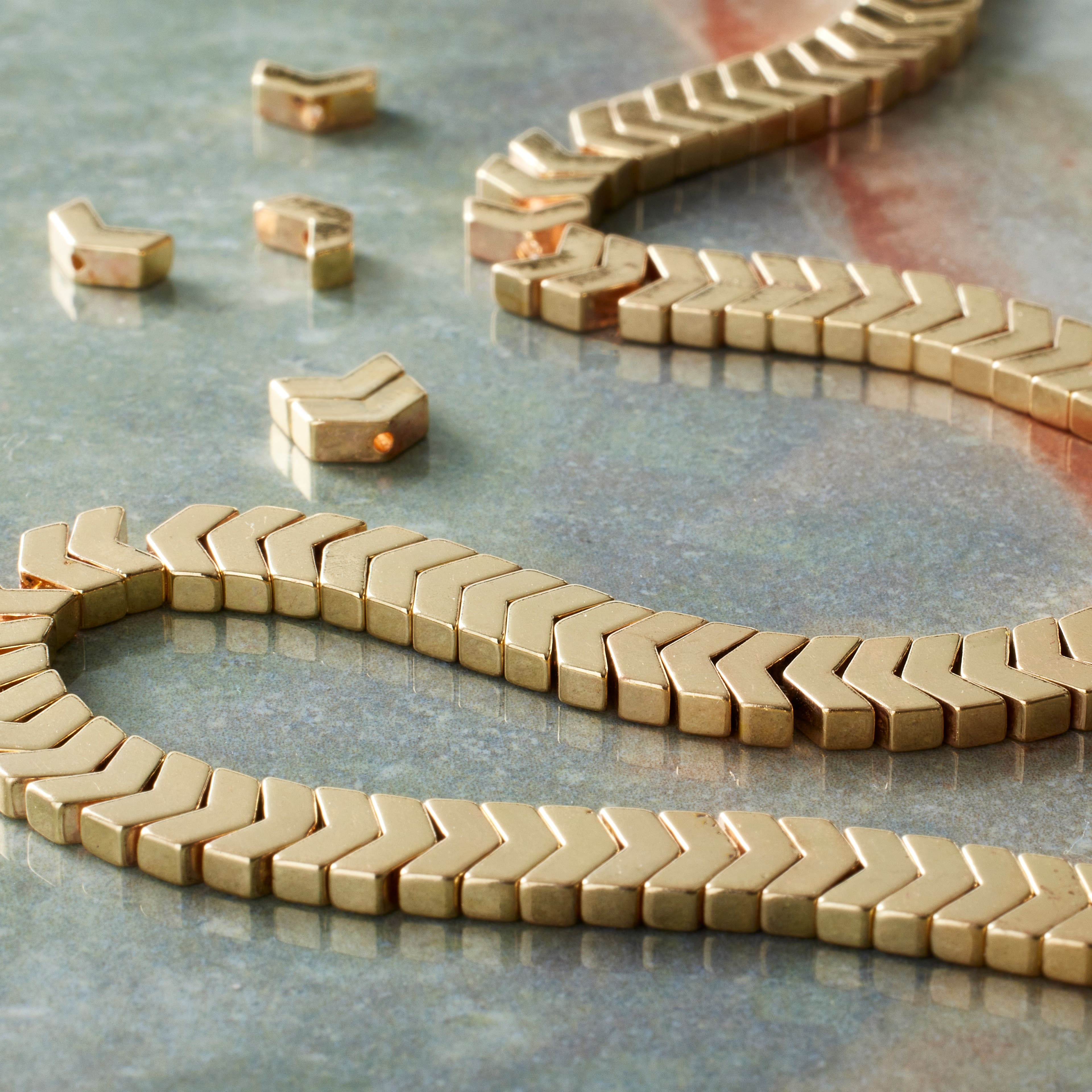 12 Pack: Gold Hematite Arrow Beads, 6mm by Bead Landing™