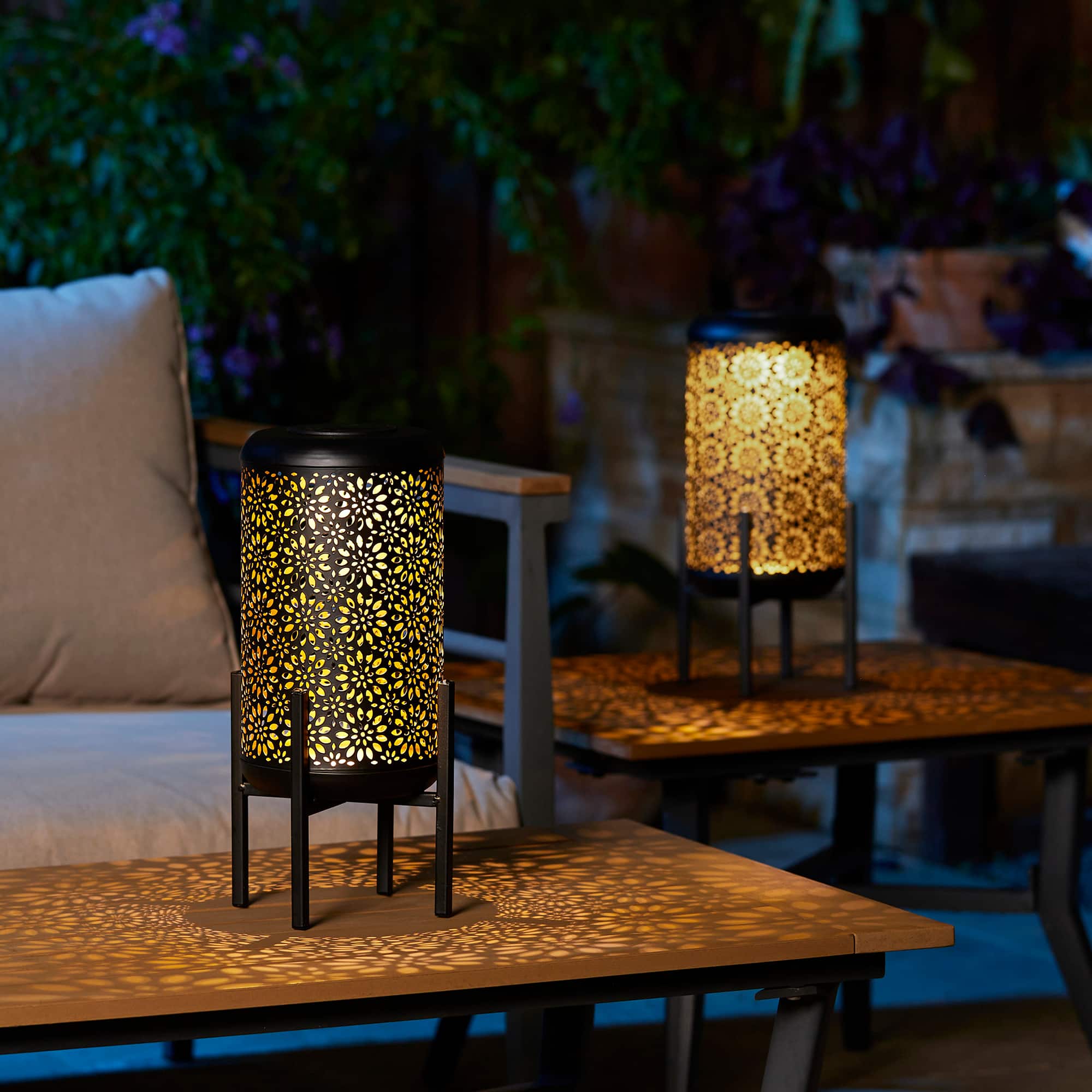 Glitzhome® 14.25" Black Metal Cutout Flower Pattern Solar Powered LED Outdoor Lanterns, 2ct.
