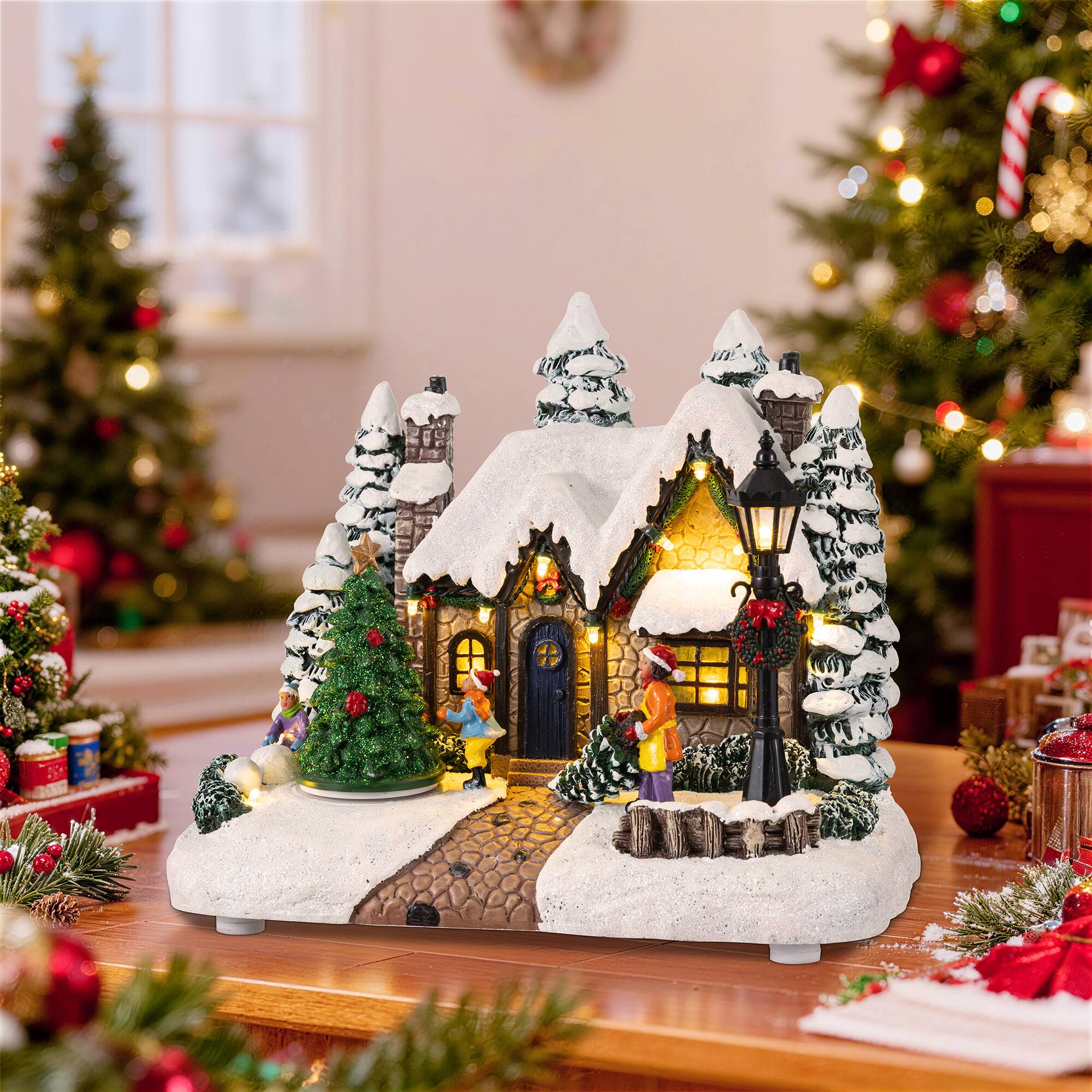 Glitzhome® 9.5" Lighted Christmas Snowy Musical Resin Village with Movement and Timer