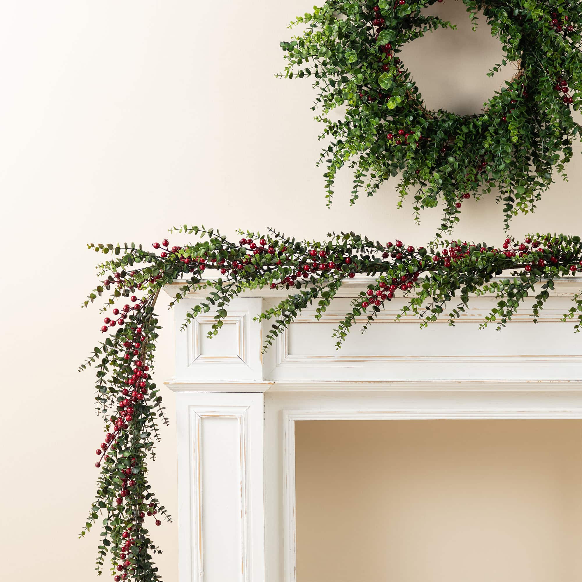Glitzhome® 9ft. Christmas Greenery PE Dripping Eucalyptus Garland with Red Berries, Set of 2