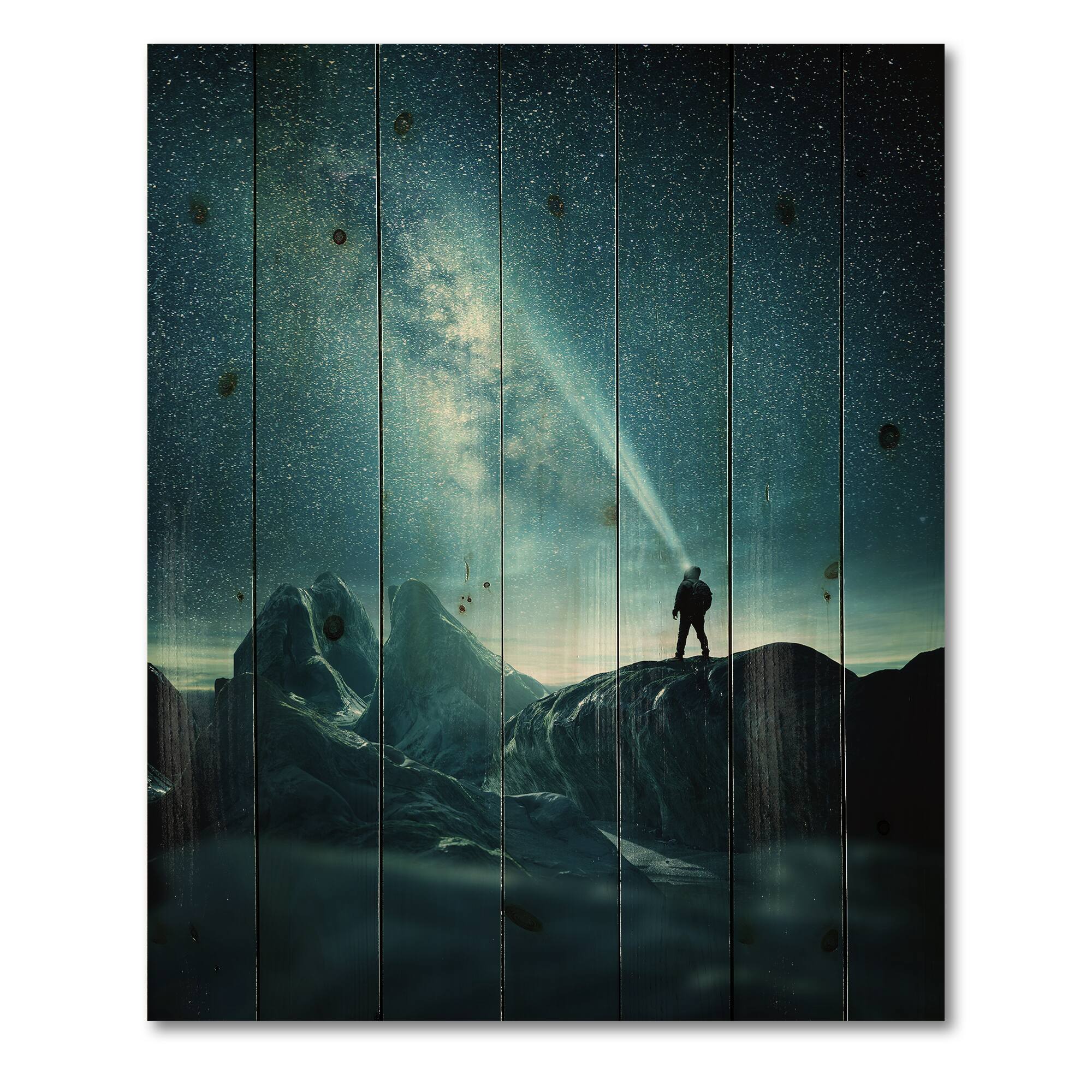 Designart - A Man Shining A Light Into The Night Sky - Modern Print on Natural Pine Wood