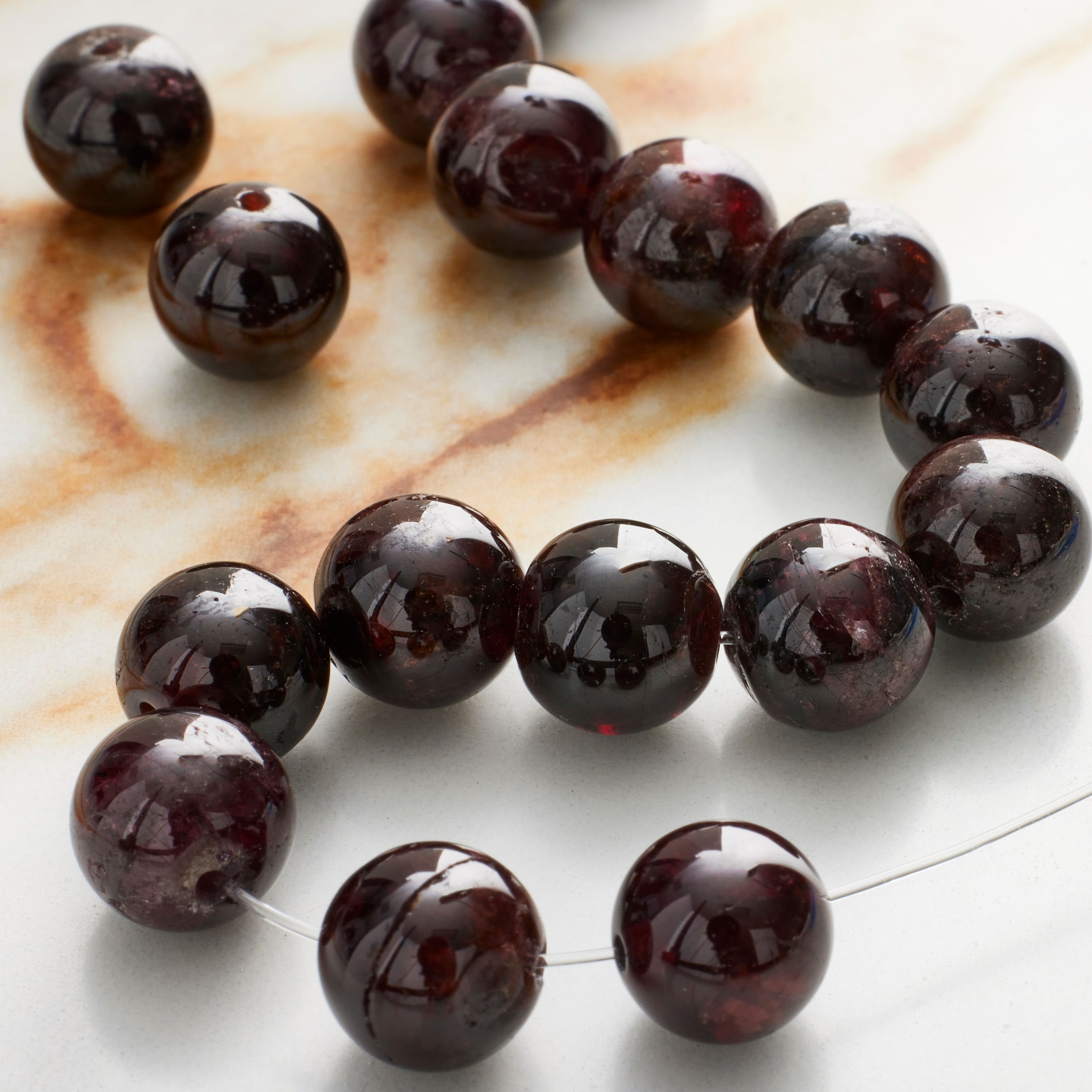 12 Pack: 7 mm Ruby Garnet Round Beads by Bead Landing™