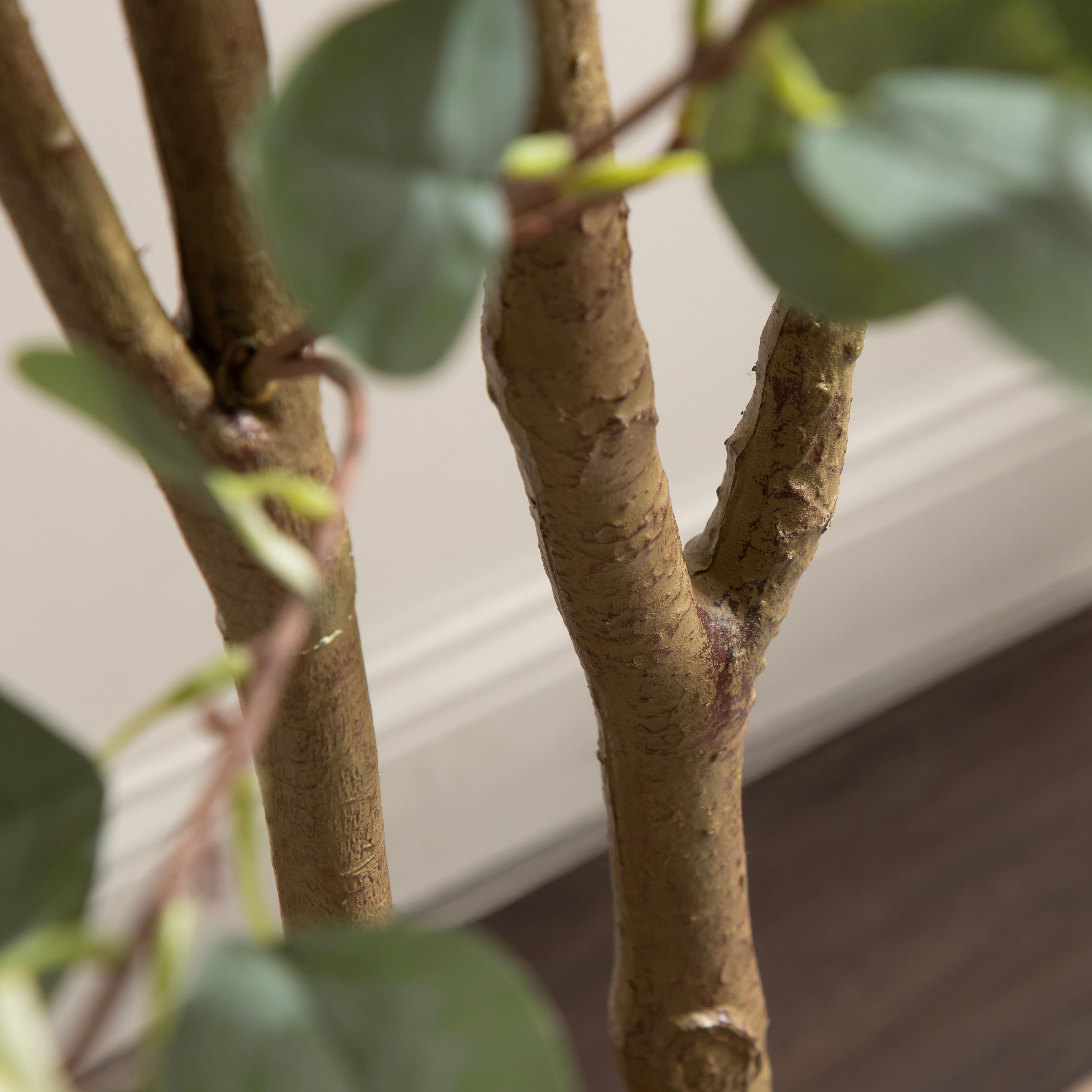 Kate and Laurel 8ft. Eudora Faux Eucalyptus Tree with Natural Planter