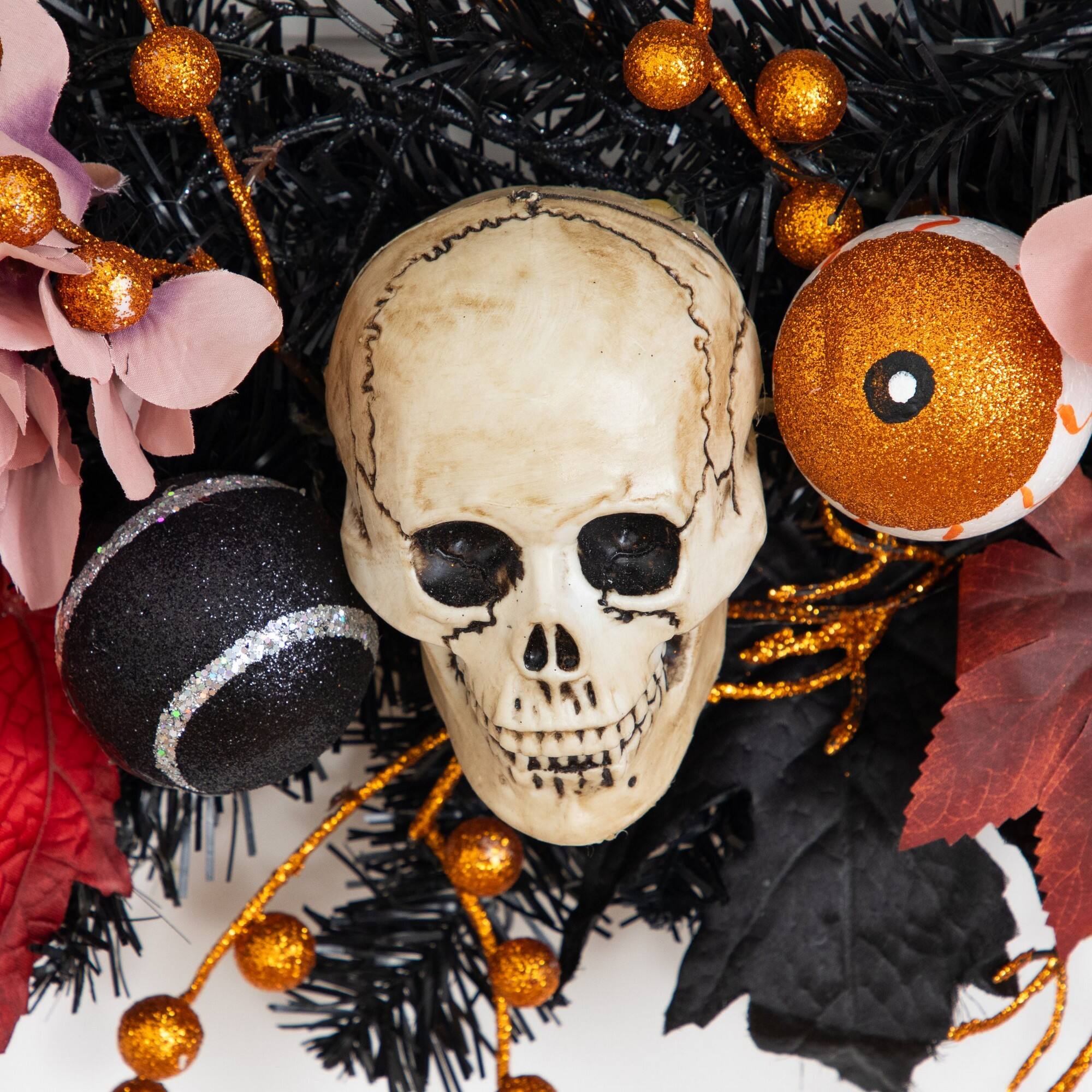 24" Artificial Halloween Wreath with Skulls, Spiders and Pumpkins