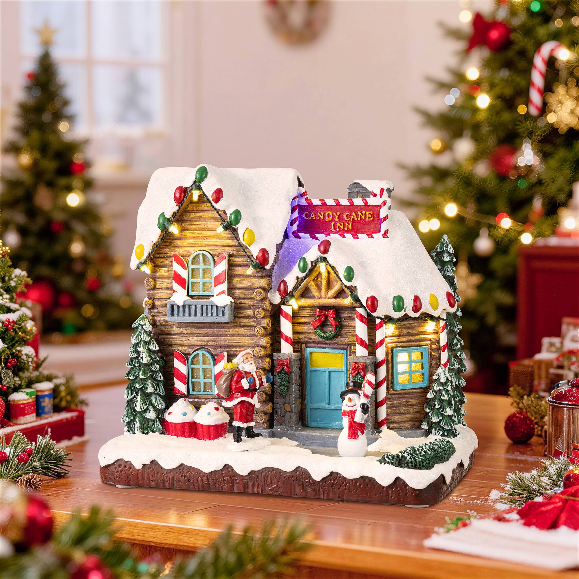 Glitzhome® 9" Lighted Christmas Candy Cane Inn Musical Resin Village with Timer