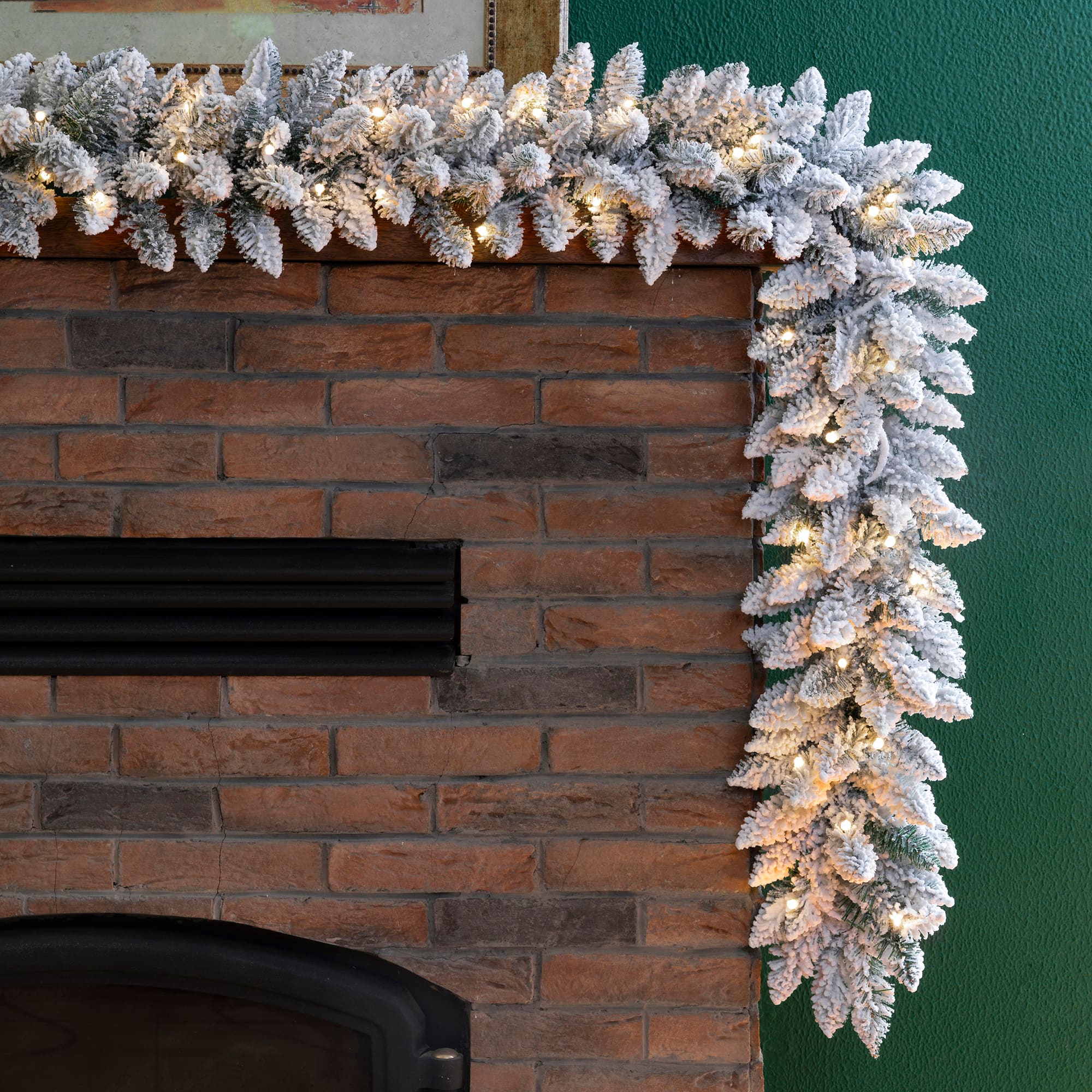 Glitzhome® 9ft. LED Snow Flocked Christmas Garlands with Timer, 2ct.