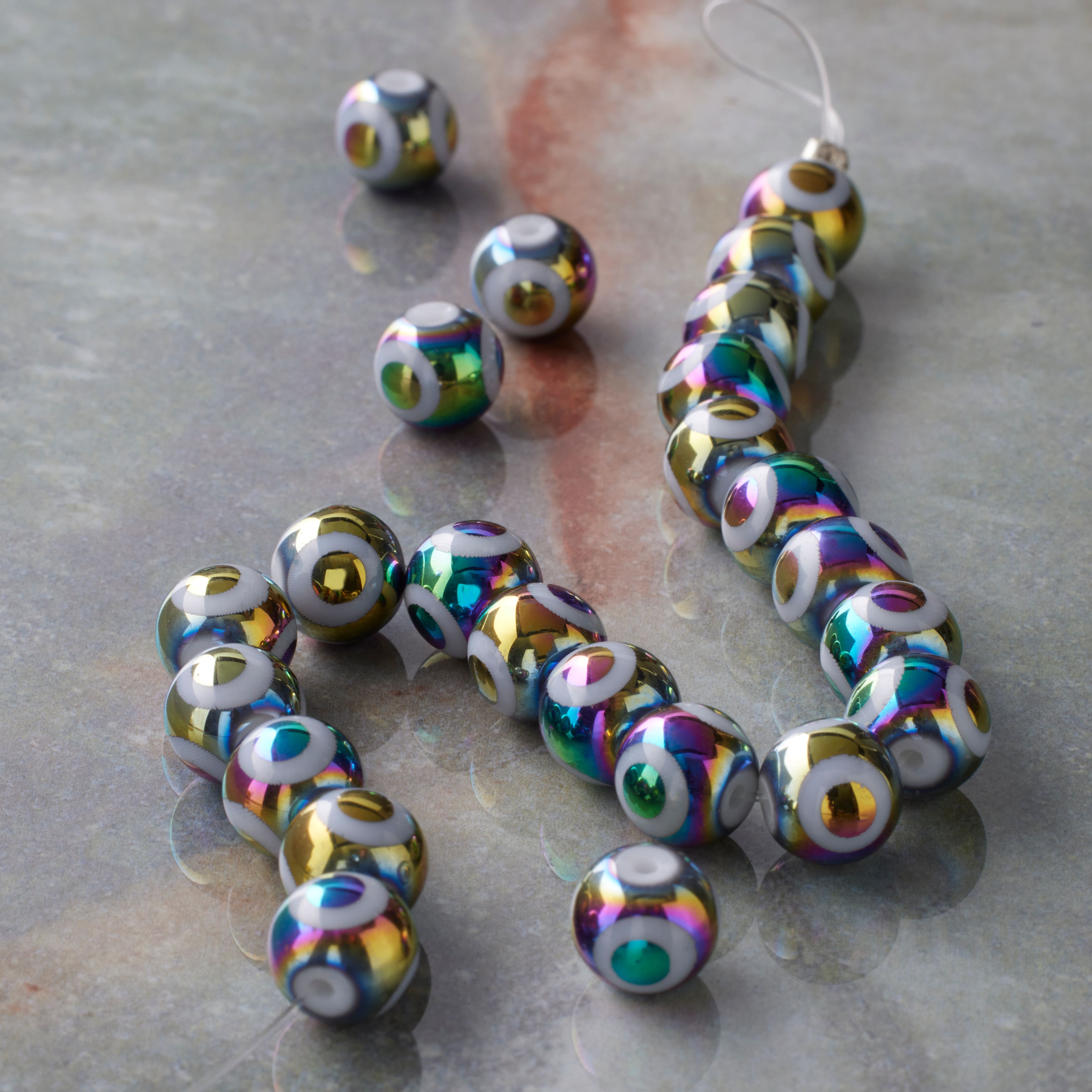 12 Packs: 23 ct. (276 total) Multicolor Glass Evil Eye Beads, 7.5mm by Bead Landing™