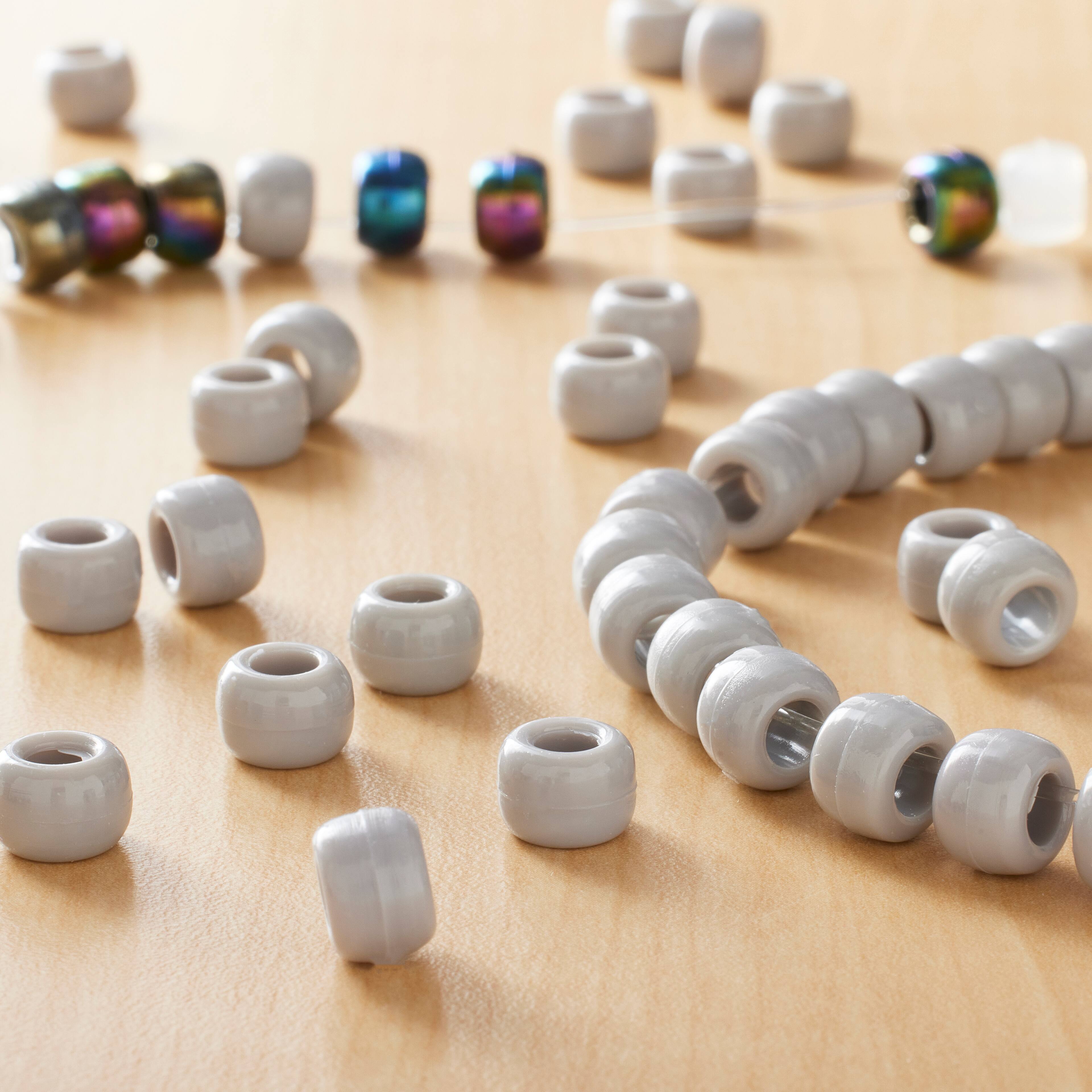 12 Packs: 580 ct. (6,960 total) Opaque Pony Beads By Creatology™, 6mm x 9mm