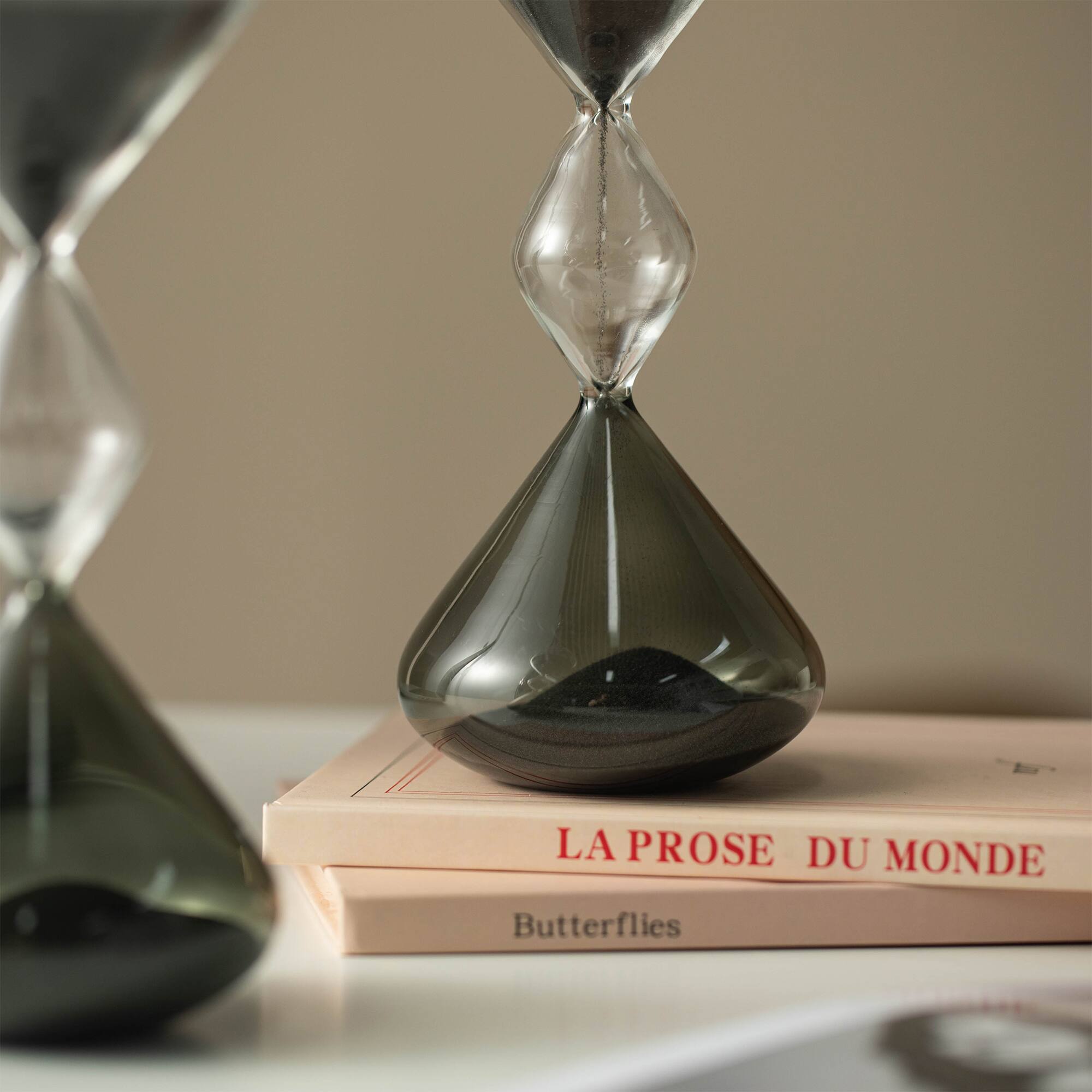 Glitzhome® 7.75" Tri-Layer Two-Tone Color Hourglasses with Black Sand, 2ct.
