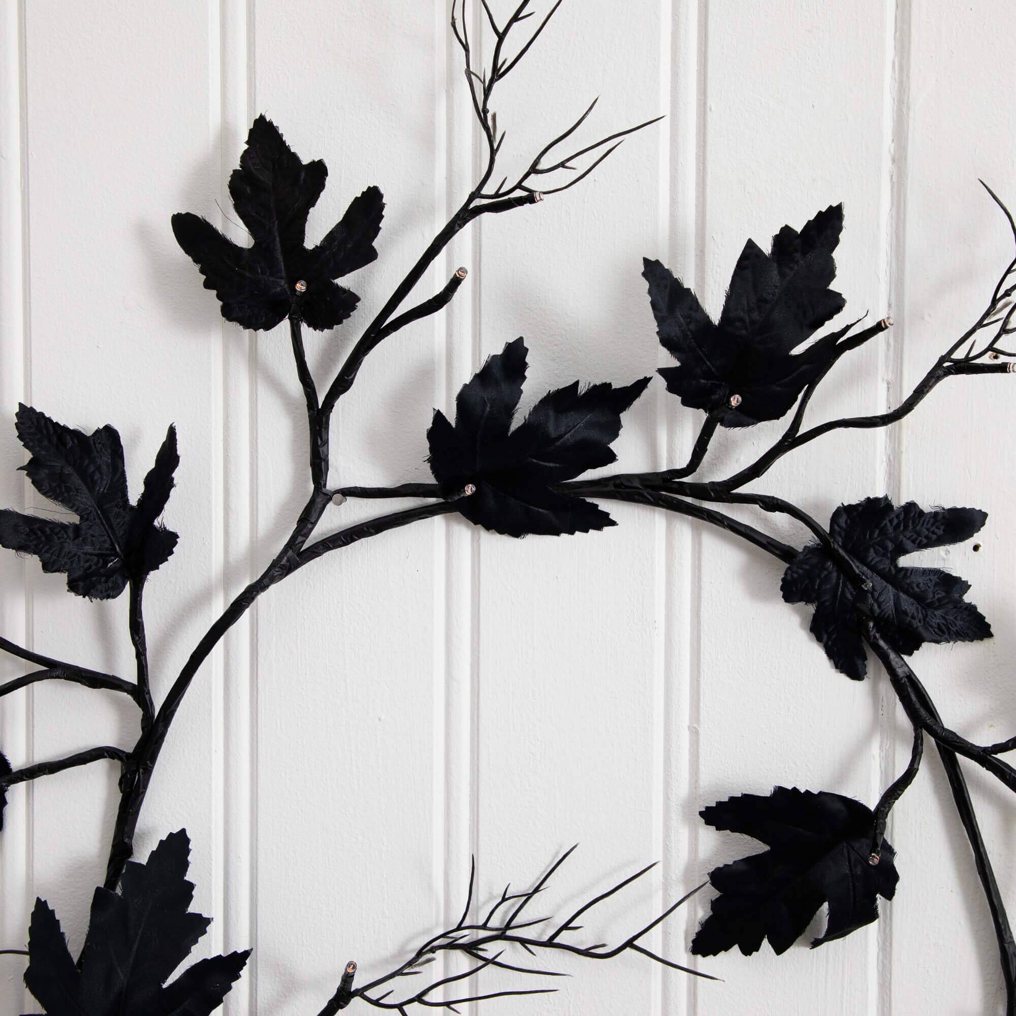 6.5ft. Pre-Lit Artificial Halloween Black Maple Garland with 48 Orange & Purple LED Lights