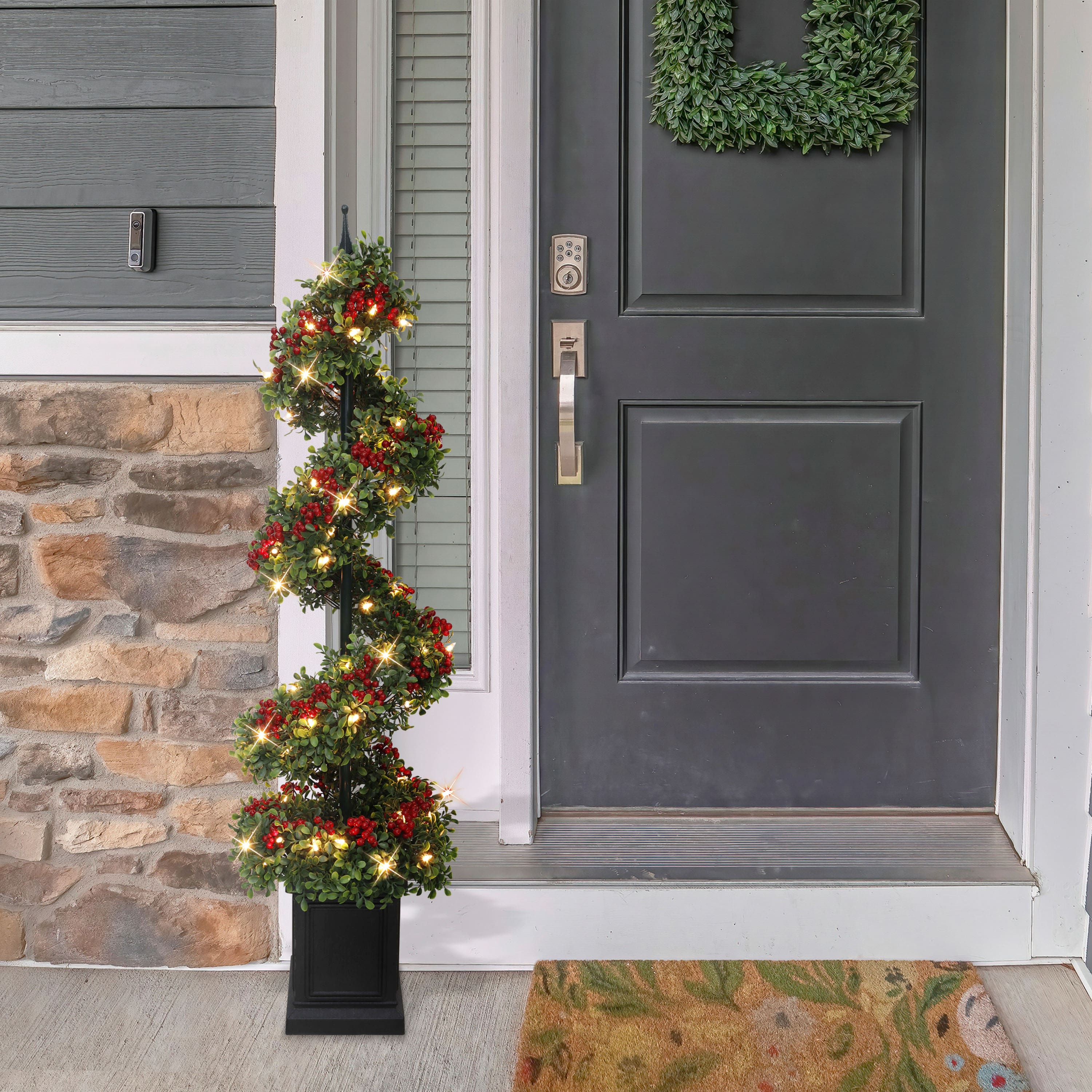 4ft. Pre-Lit Artificial Potted Swirl Tree Adorned with Red Berries, Warm White LED Lights
