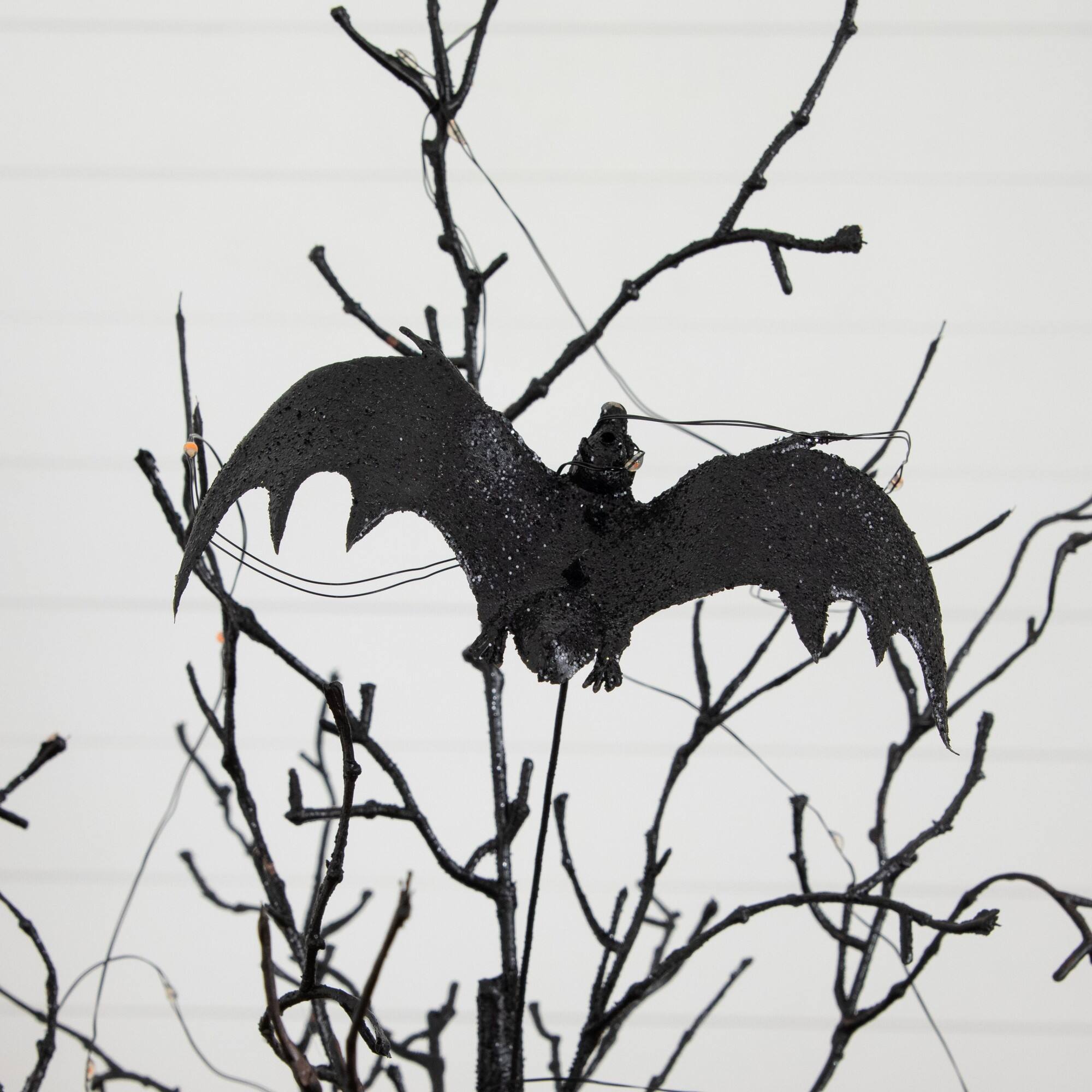 2ft. Pre-Lit Artificial Black Spooky Twig Tree with Bats and 40 Orange & Purple LED Lights