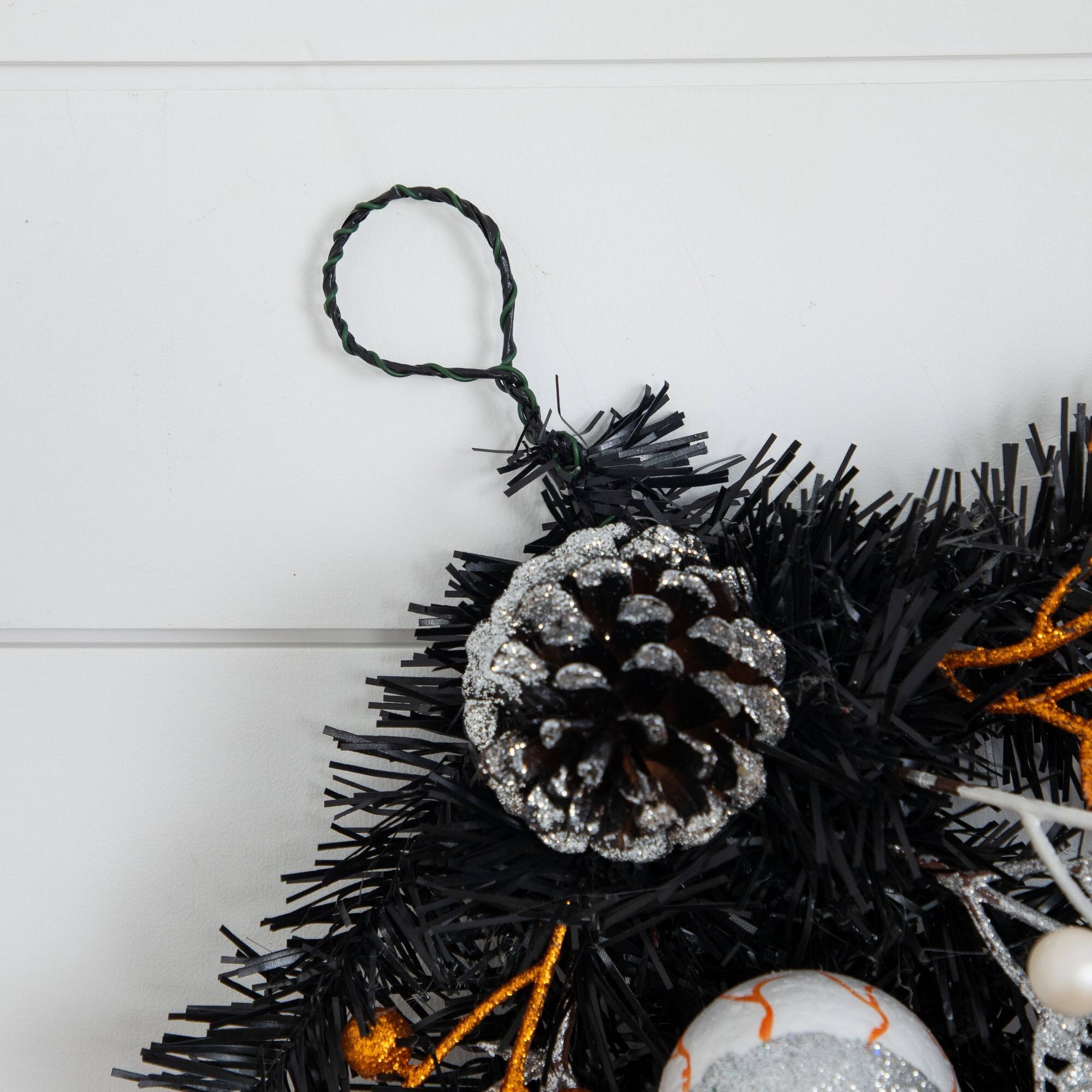 6ft. Artificial Halloween Black Garland with Skulls, Eyeballs & Spiders