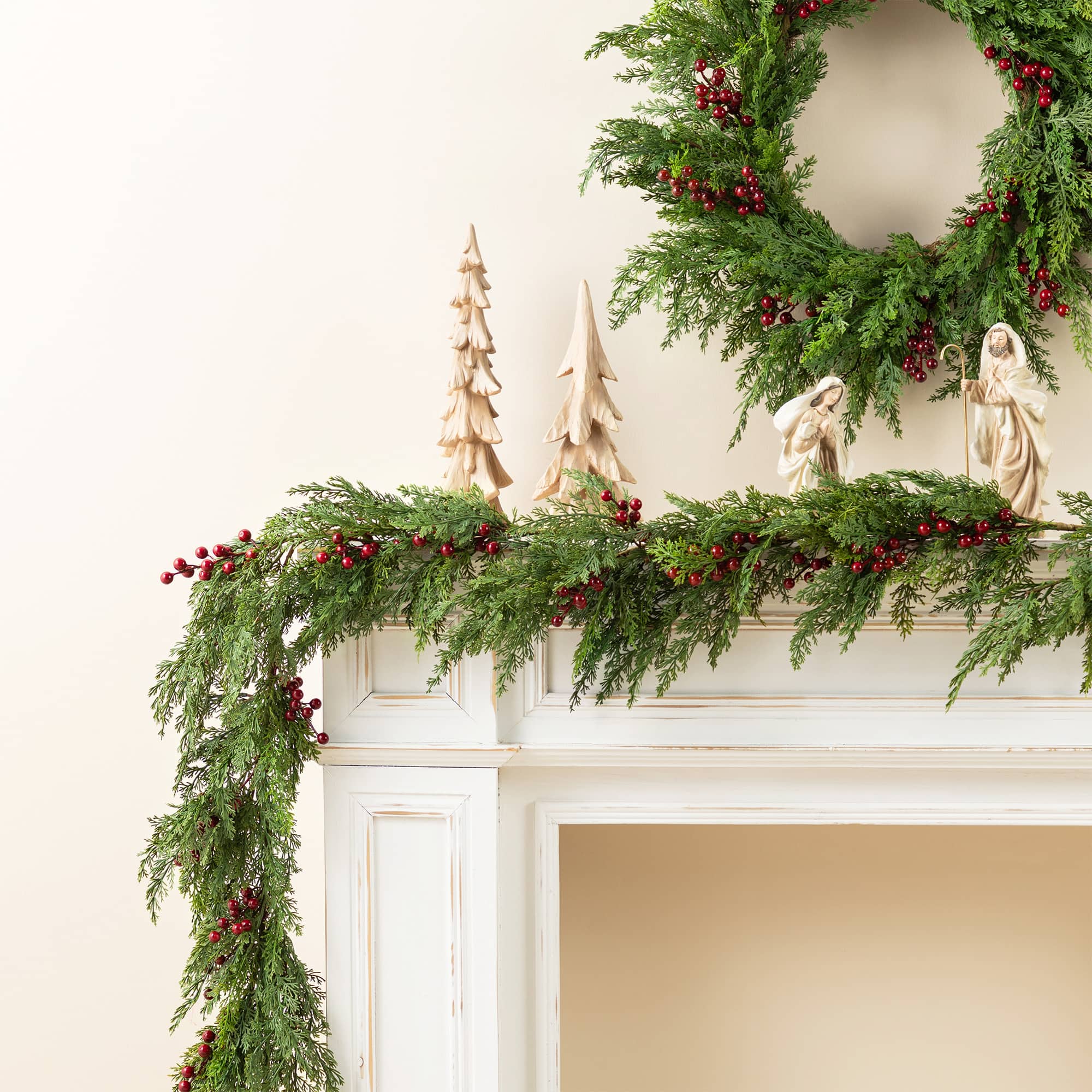 Glitzhome® 9ft. Christmas Greenery PE Dripping Cedar Garland with Red Berries, Set of 2