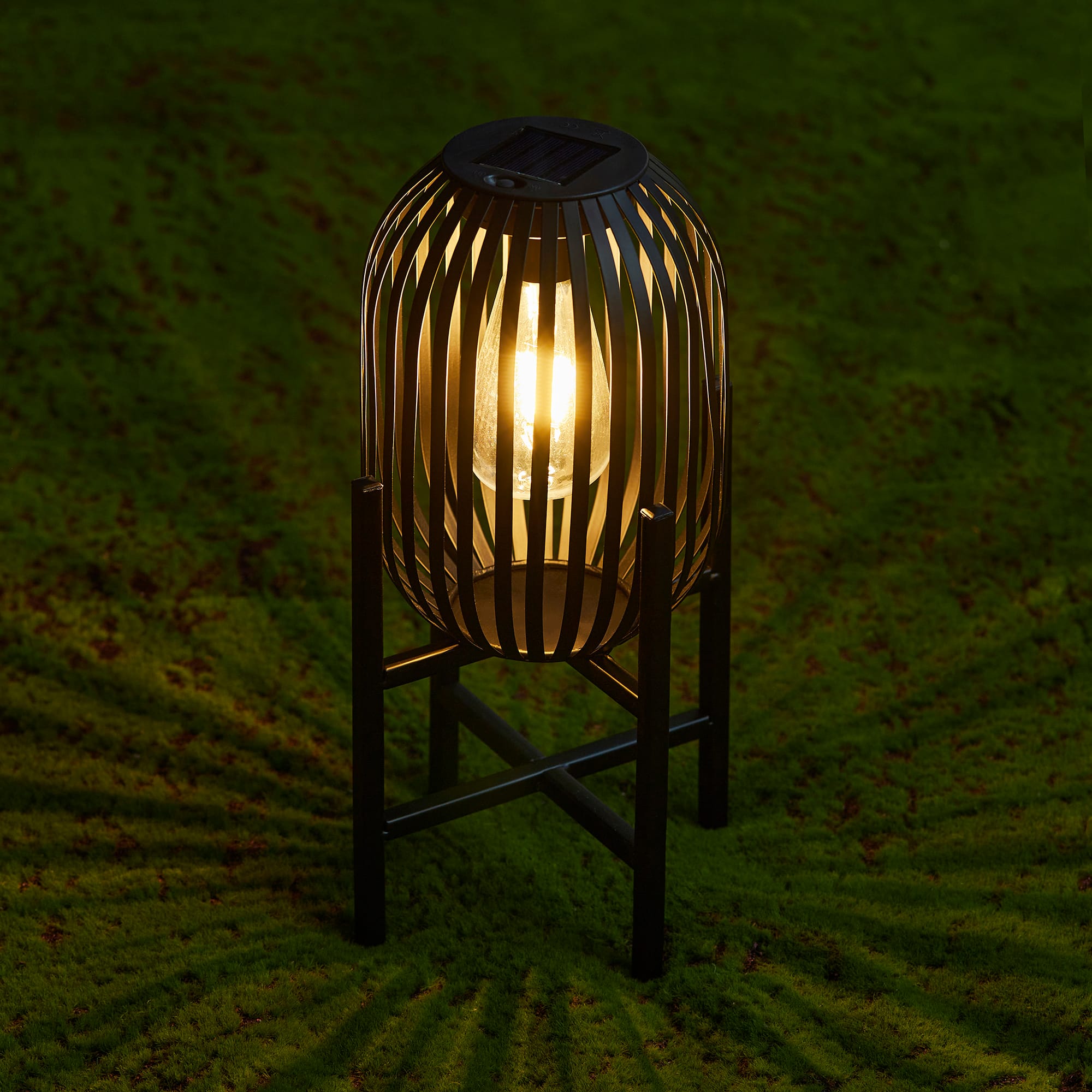 Glitzhome® 14.25" Black Slim Metal Stripes Solar Powered Edison Bulb Outdoor Lantern, 2ct.