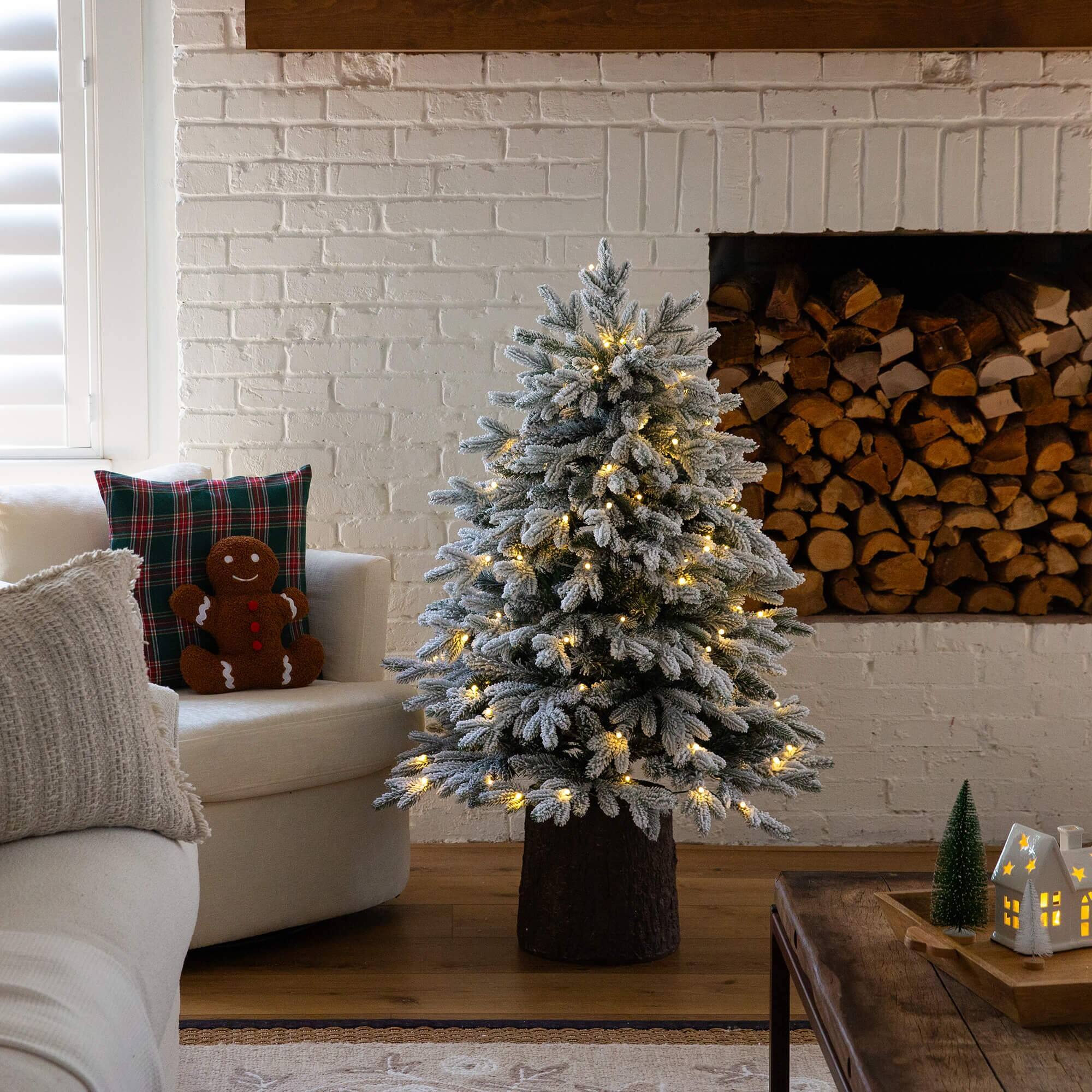 4ft. Pre-Lit Flocked Artificial Christmas Tree in Black Decorative Planter, Warm White LED Lights
