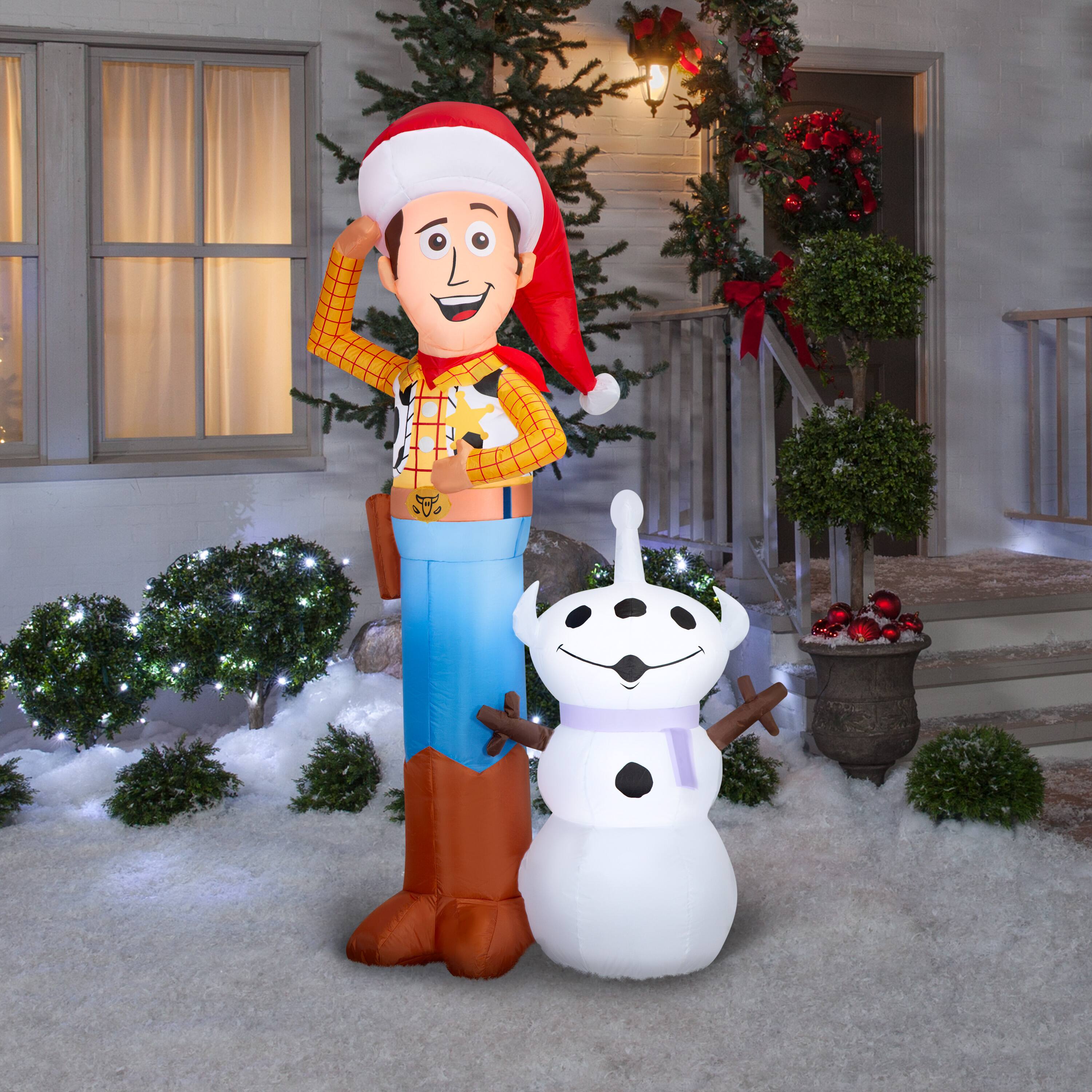 6ft. Airblown® Inflatable Disney® Woody with Snowman Scene Christmas Light Décor