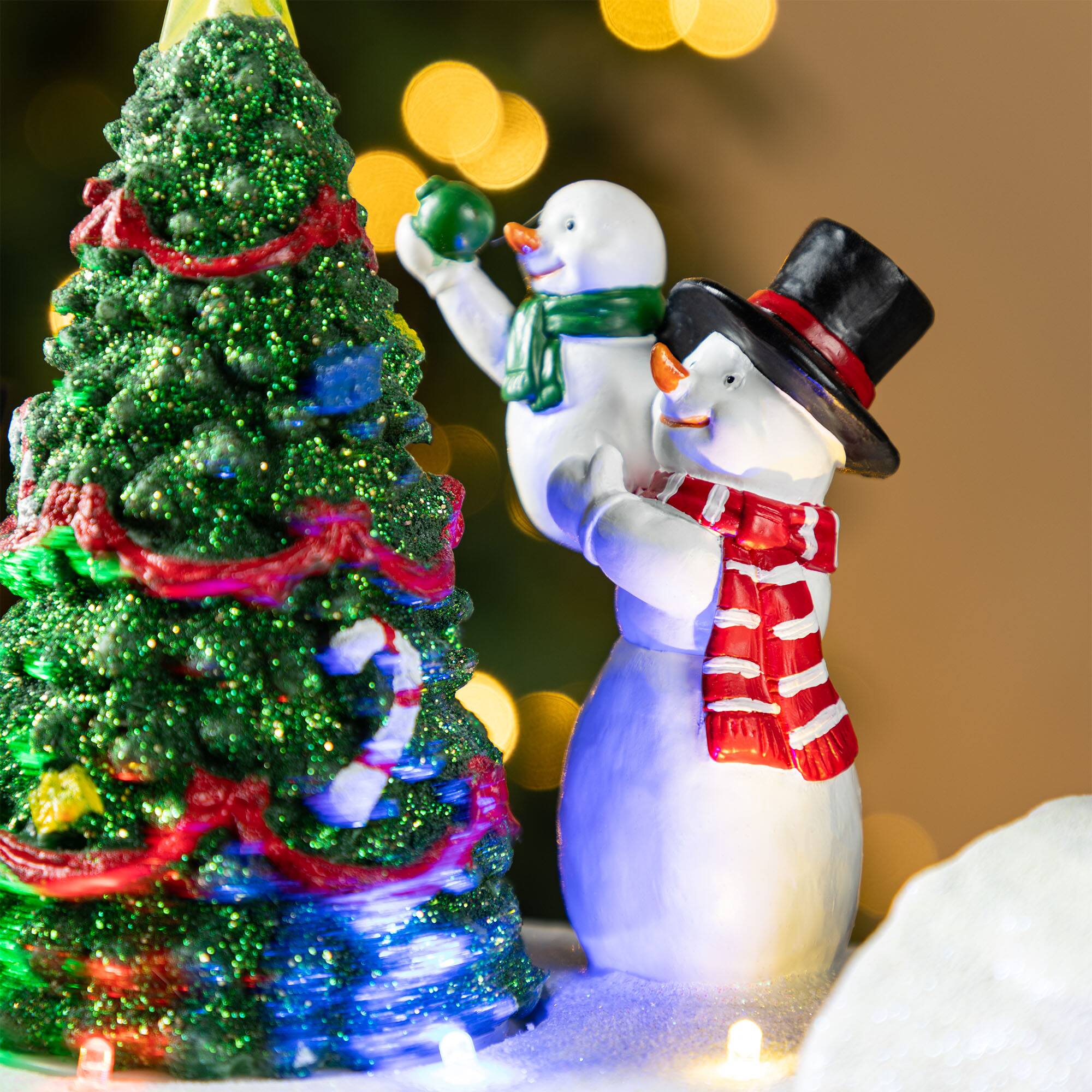 Glitzhome® 20" Lighted Christmas Santa Train Resin Village with Movement and Music