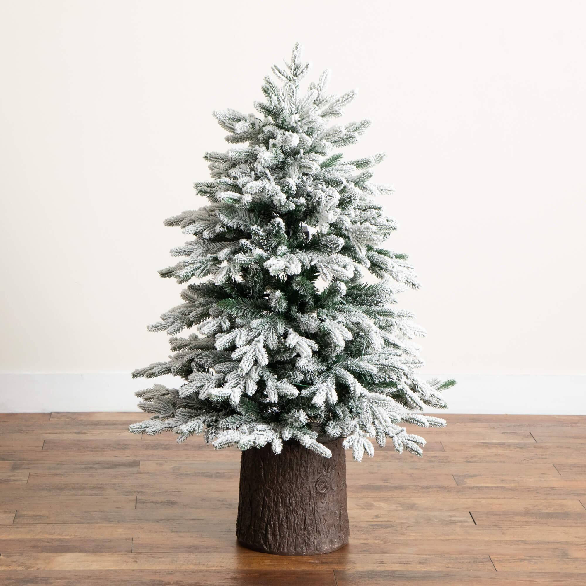 4ft. Pre-Lit Flocked Artificial Christmas Tree in Black Decorative Planter, Warm White LED Lights