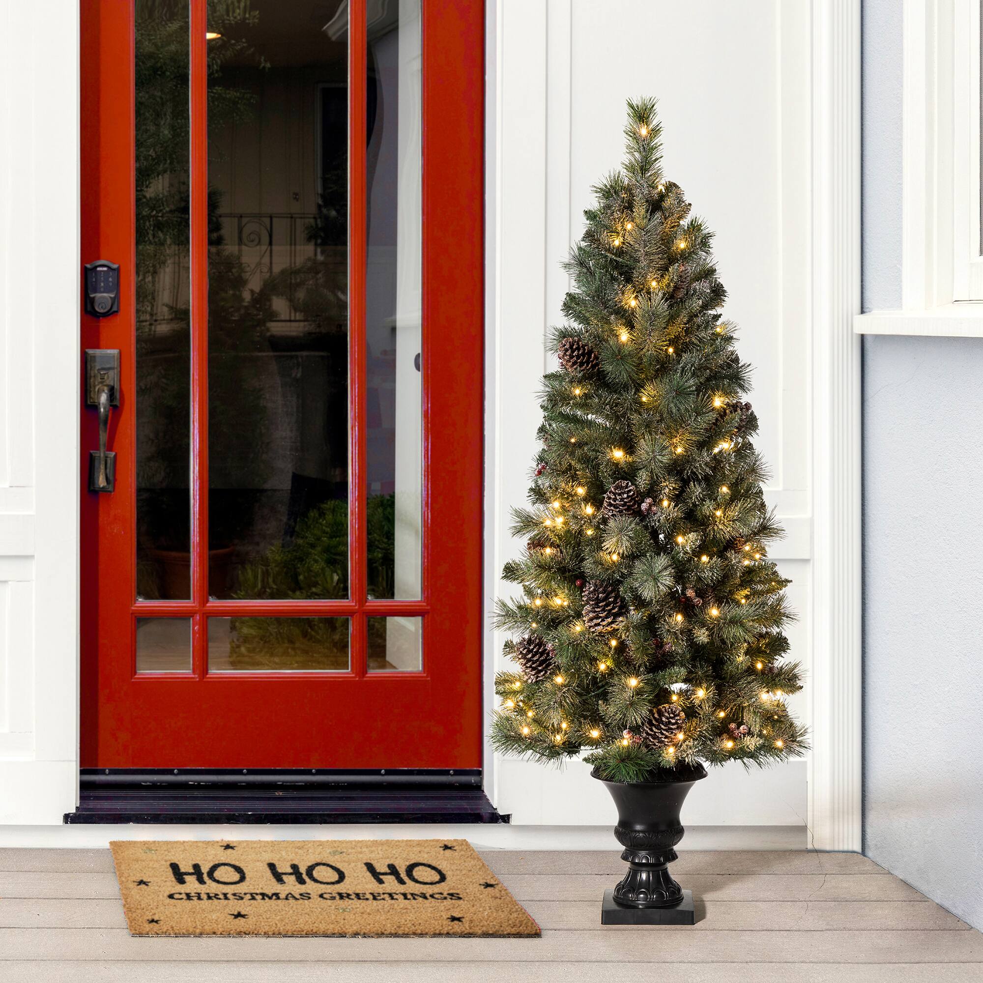 5ft. Pre-Lit Flocked Pine Artificial Christmas Tree in Black Urn, Warm White Lights