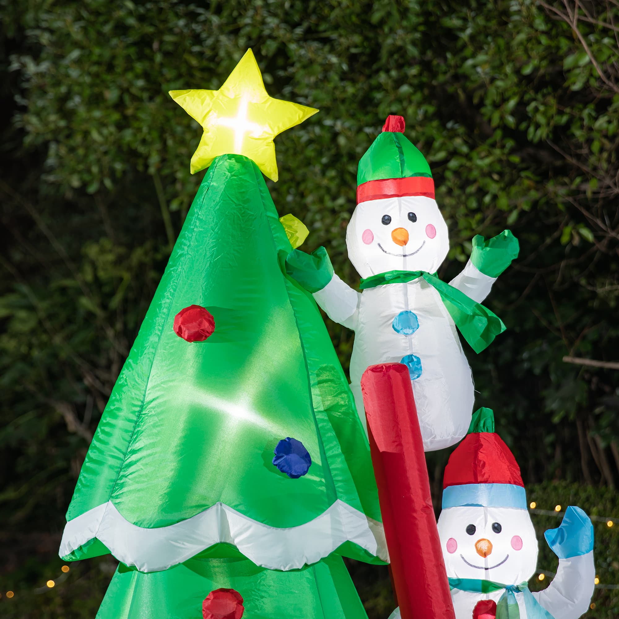 Glitzhome® 8ft. Lighted Inflatable Xmas Snowman Climbing Up Tree Décor