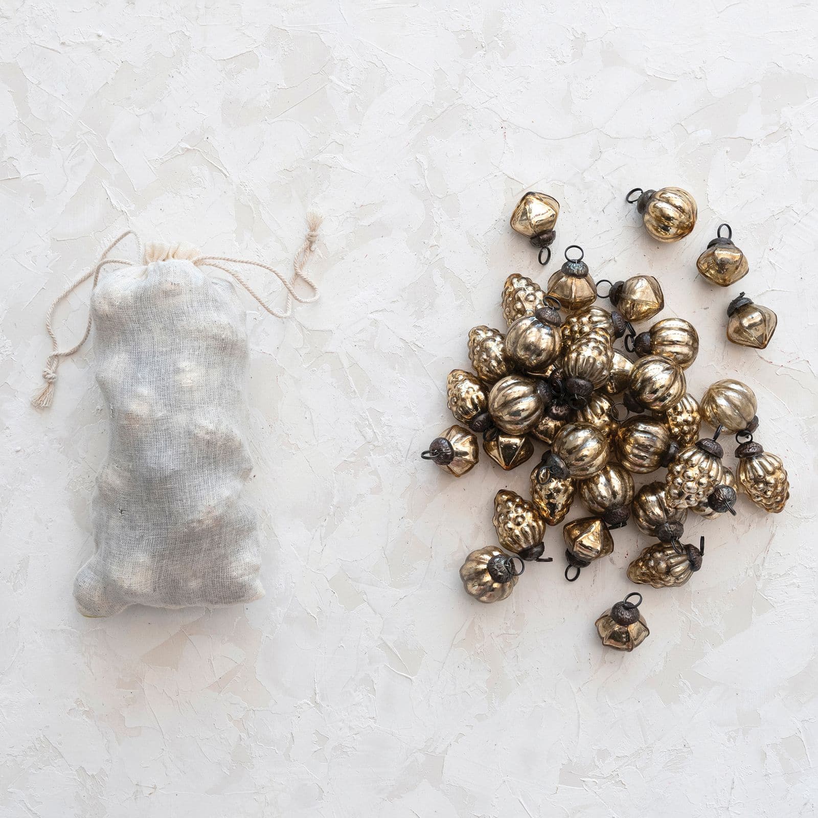 Hello Honey® 36 Pack 1" Antique Gold Mixed Shape Embossed Mercury Glass Ornaments