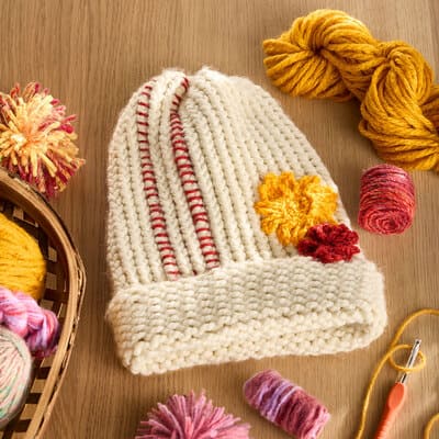 Knit Hat with Yarn Embellishments | Michaels
